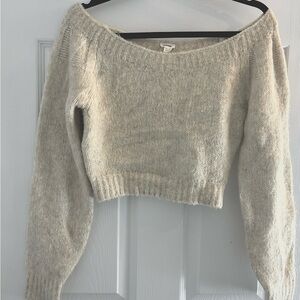 Garage | Off-The-Shoulder Sweater fits XS-M . Made with a soft knit fabrication.